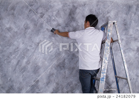 worker use brush for color paint concrete Loft style on wall worker use brush for color paint concrete Loft style on wall 24182079