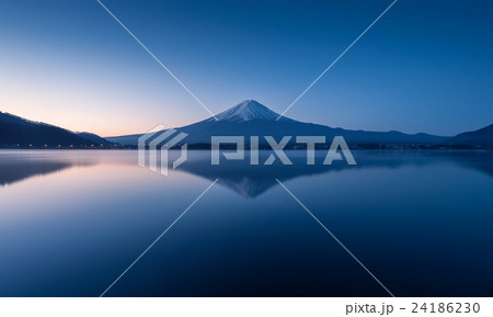 mount Fuji at dawn with peaceful lake reflection 24186230