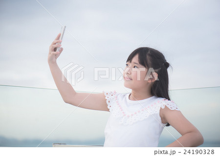 asian girl use smart phone taking photo 24190328