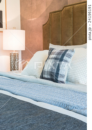 luxury bedroom with set of pillows on bed  24196191