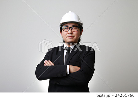 The Asian engineer standing with crossed arms. The Asian engineer standing with crossed arms. 24201766