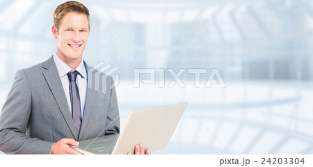 Composite image of happy businessman with laptop Composite image of happy businessman with laptop 24203304