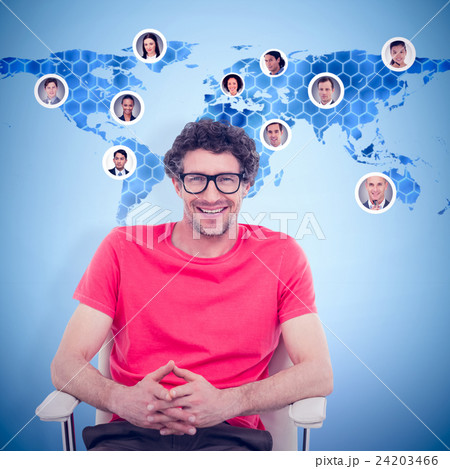 Composite image of happy businessman wearing reading glasses whi 24203466