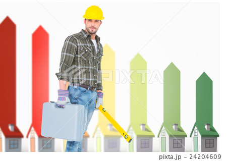 Composite image of manual worker with spirit level and toolbox 24204609