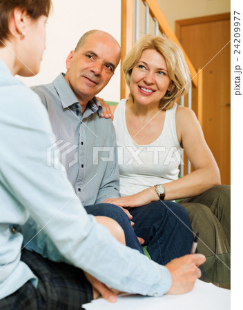Mature couple with insurance agent Mature couple with insurance agent 24209977