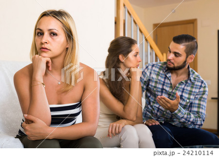 person keeping silence turned away from friends 24210114