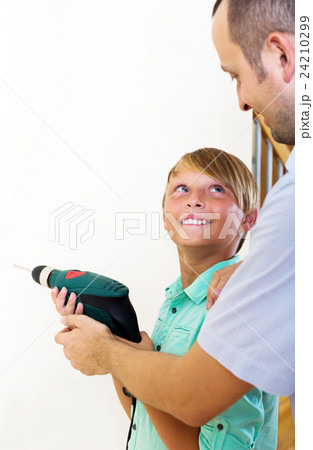 Father and son repairing house Father and son repairing house 24210299