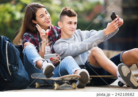 Teenagers taking selfie with smartphone Teenagers taking selfie with smartphone 24210682