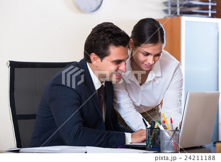 Chief manager and young employee. 24211188