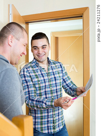 Two neighbors talking 24211276