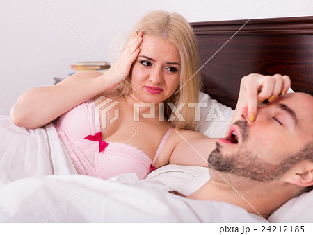 wife with husband snoring in sleep 24212185