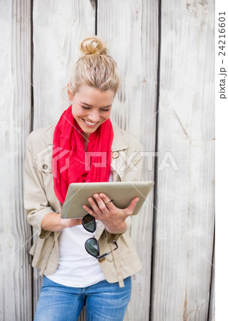 Young woman using digital tablet Young woman using digital tablet 24216601