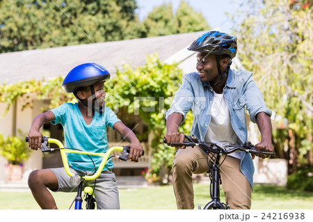 Happy family doing bicycle Happy family doing bicycle 24216938