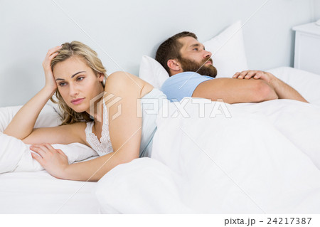 Couple upset after having a fight on bed Couple upset after having a fight on bed 24217387