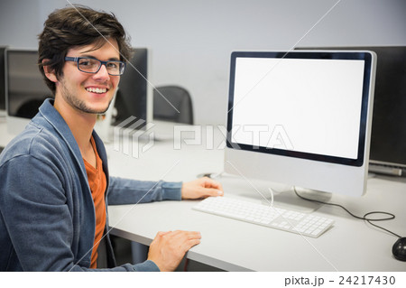 Portrait of happy student using computer Portrait of happy student using computer 24217430