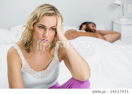 Woman upset with man after a fight 24217431