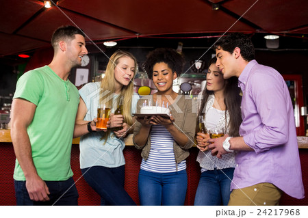 Friends celebrating with cake Friends celebrating with cake 24217968