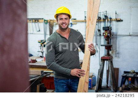 Carpenter is posing with his craft Carpenter is posing with his craft 24218295