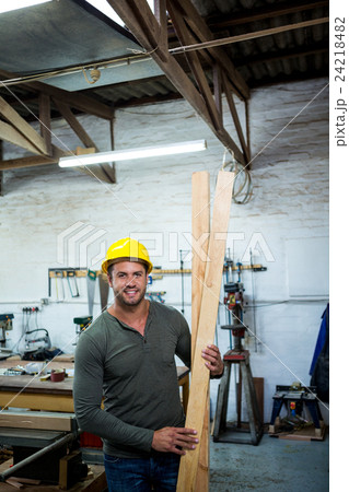 Carpenter is posing with his craft 24218482