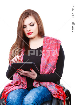 Woman invalid girl on wheelchair using tablet Woman invalid girl on wheelchair using tablet 24219420