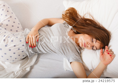 Sleepy woman sleeping in the bed. Sleepy woman sleeping in the bed. 24219575