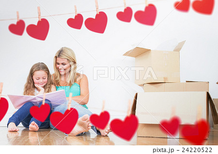 Composite image of mother and daughter reading a book 24220522