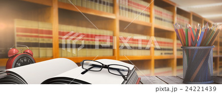 Composite image of school supplies on desk Composite image of school supplies on desk 24221439