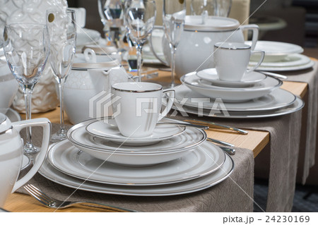 white luxury ceramic dinner service on table 24230169