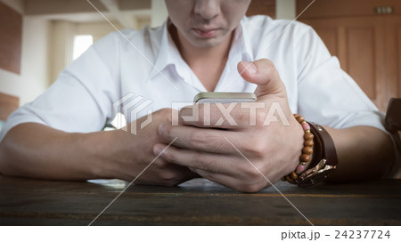 businessman using a mobile phone with texting 24237724