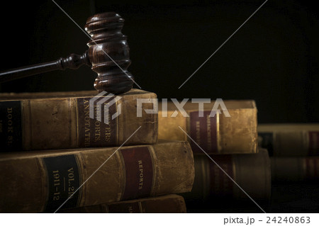 Wooden hammer on stack of books Wooden hammer on stack of books 24240863
