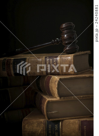 Wooden hammer on stack of books Wooden hammer on stack of books 24240881