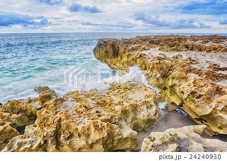 Wave splashing on coastline 24240930