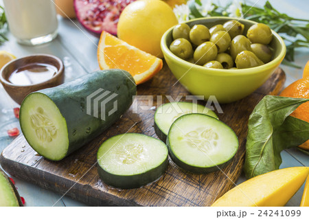 Fresh slices of cucumber and bowl of olives Fresh slices of cucumber and bowl of olives 24241099