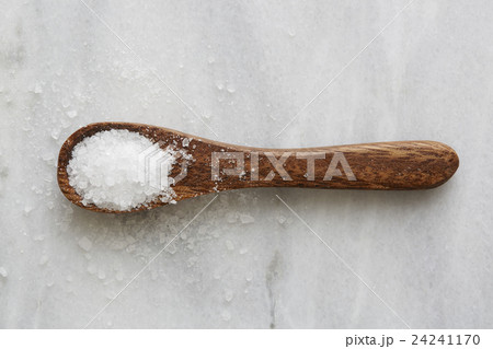 Overhead view of wooden spoon with sea salt 24241170
