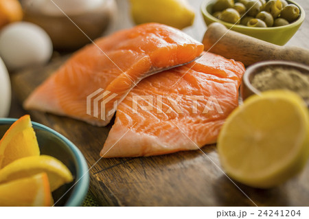 Fresh slices of salmon and lemon Fresh slices of salmon and lemon 24241204