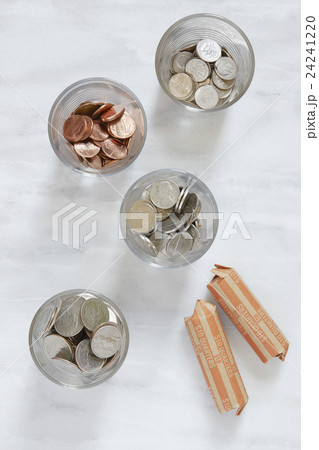 Overhead view of coins in glasses 24241220
