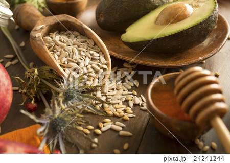 Wheat seeds, avocado and honey with dipper 24241244