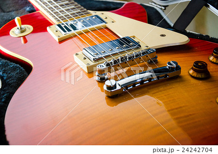 Close Up of a Sunburst Electric Guit Close Up of a Sunburst Electric Guit 24242704