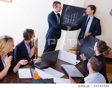 handshake between businessmen handshake between businessmen 24245430