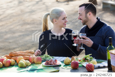 Couple having picnic at countryside 24246725