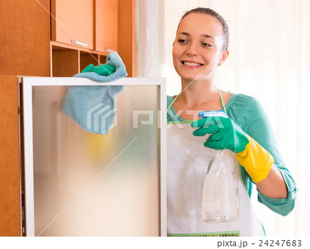 Woman cleaning office room Woman cleaning office room 24247683