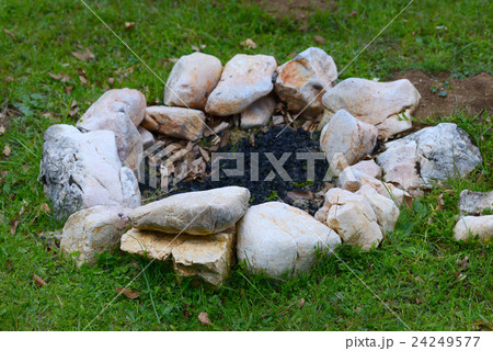 Open fire outdoors.Chic bonfire topped with stones Open fire outdoors.Chic bonfire topped with stones 24249577