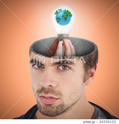Composite image of hand holding environmental light bulb 24250132