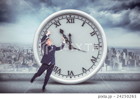 Composite image of scared buisnessman with hands raised 24250263