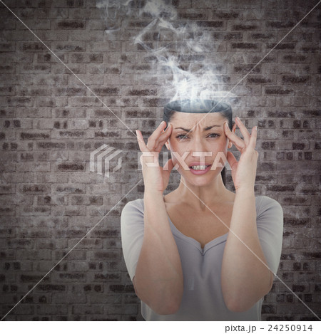 Composite image of brunette suffering from migraine  24250914