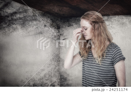 Composite image of blonde woman with headache pinching her nose Composite image of blonde woman with headache pinching her nose 24251174
