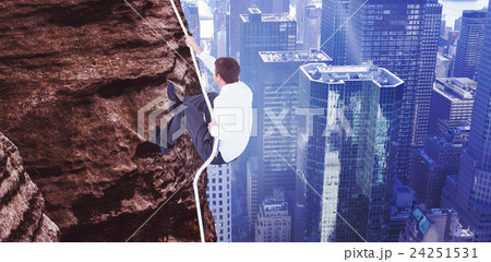 Composite image of businessman pulling a rope with effort Composite image of businessman pulling a rope with effort 24251531