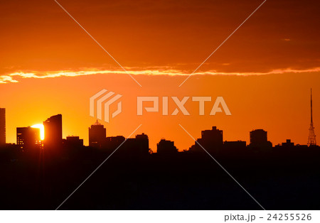 Sunset behind city skyline 24255526