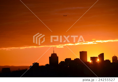 Sunset behind city skyline 24255527