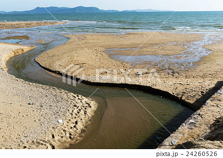 Small canal on sand beach Small canal on sand beach 24260526